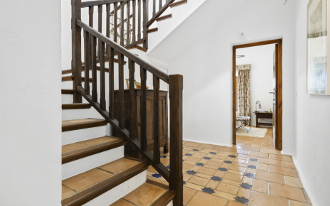 Stairs to first floor with master bedroom